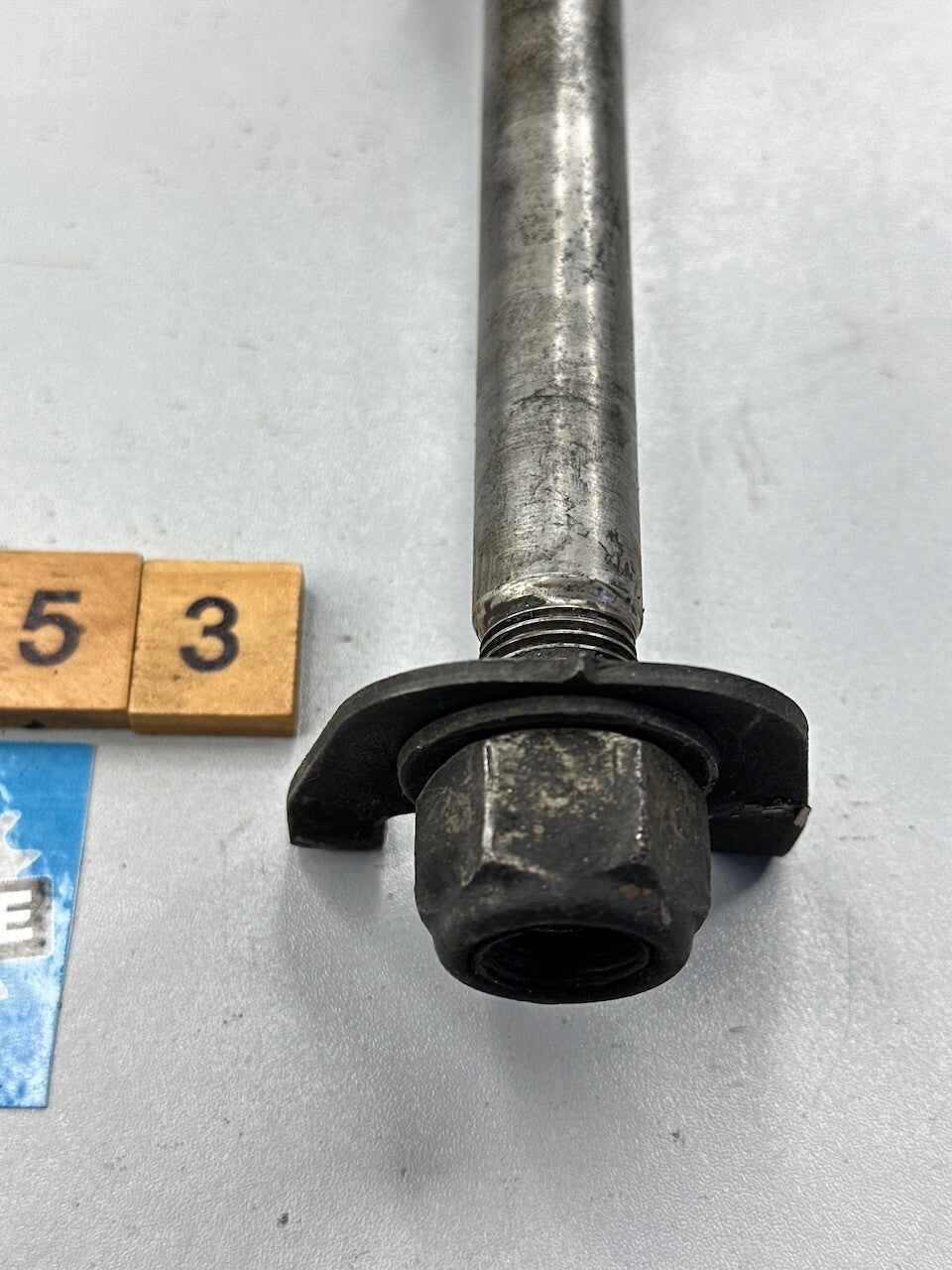 Suzuki GR650 1983-84 Rear Wheel Axle, Spacer, Chain Guides & Nut 64711-15501
